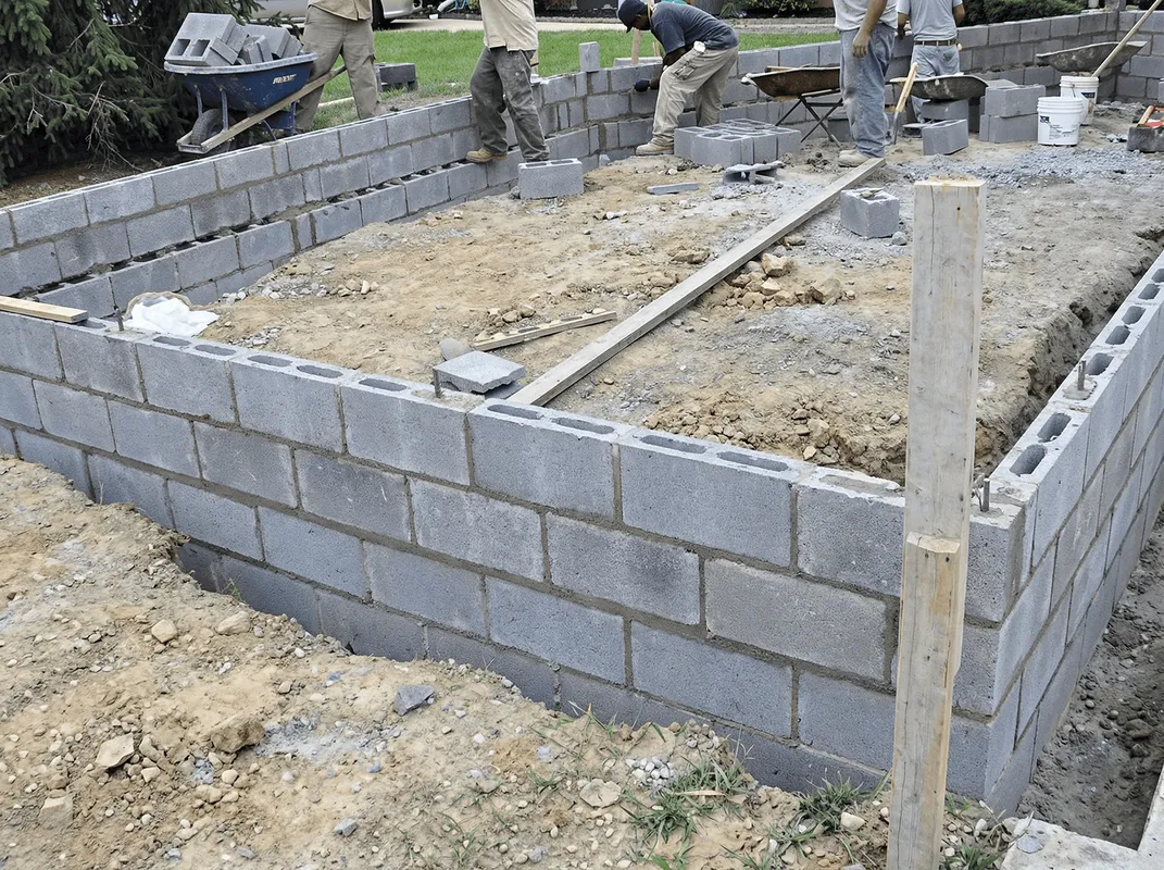 Professionals building a foundation with blocks in Santa Ana, CA