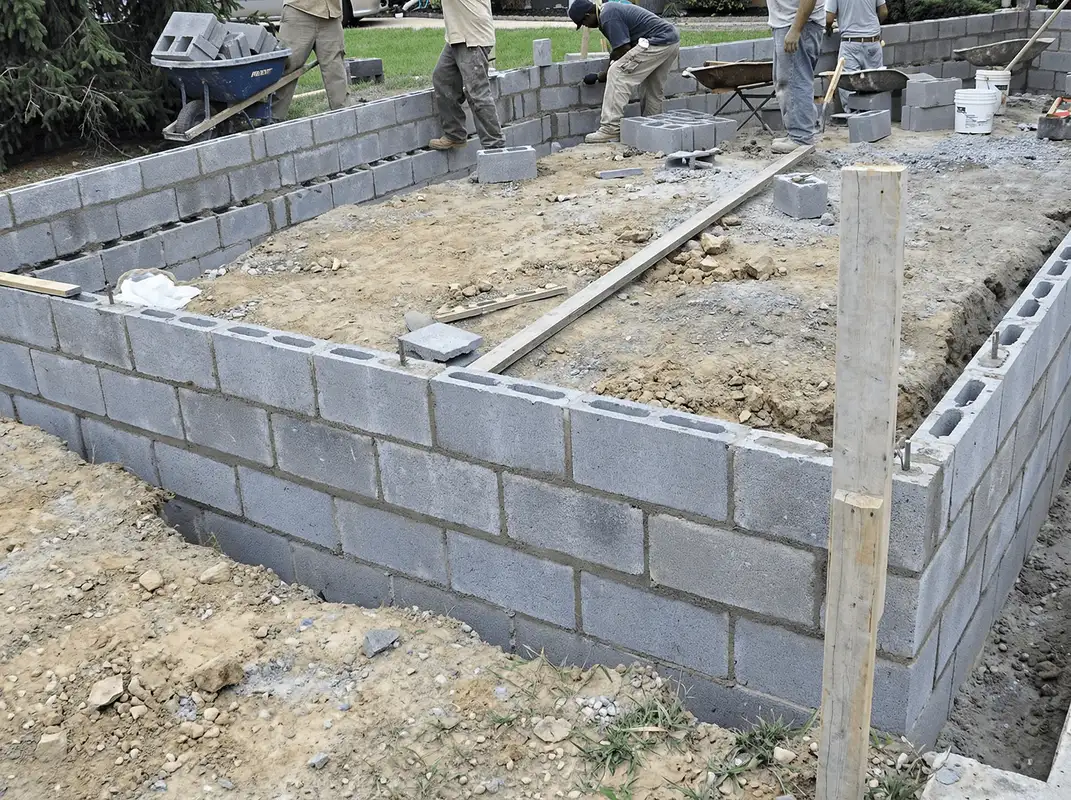 Professionals building a foundation with blocks in Santa Ana, CA