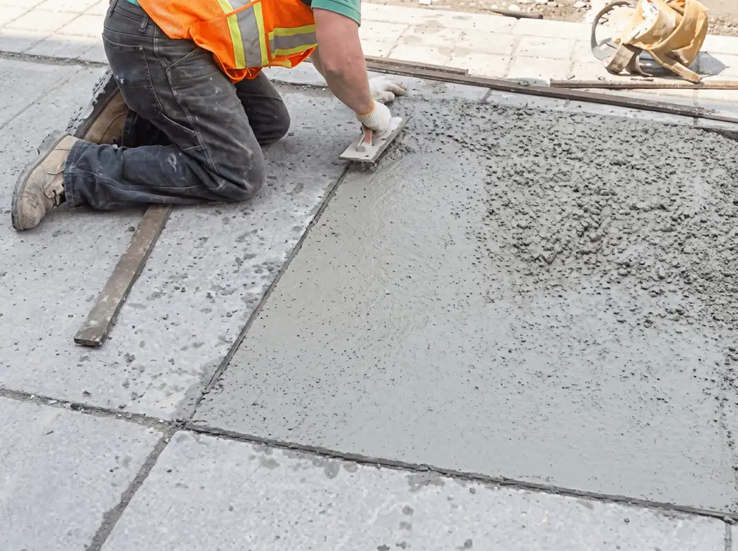 Professional repairing a concrete floor in Santa Ana, CA