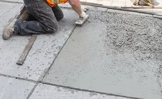 Professional repairing a concrete floor in Santa Ana, CA