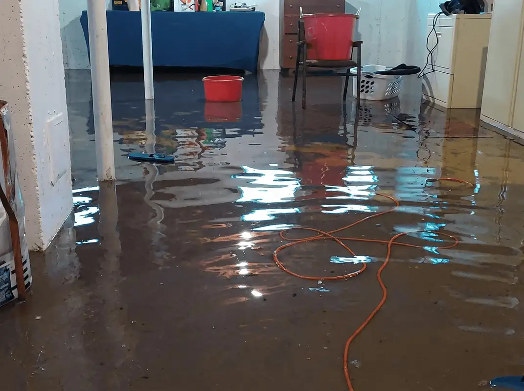 Basement with boiler, cabinets and washing machine completely flooded in Santa Ana, CA