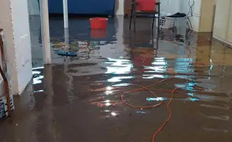 Basement with boiler, cabinets and washing machine completely flooded in Santa Ana, CA